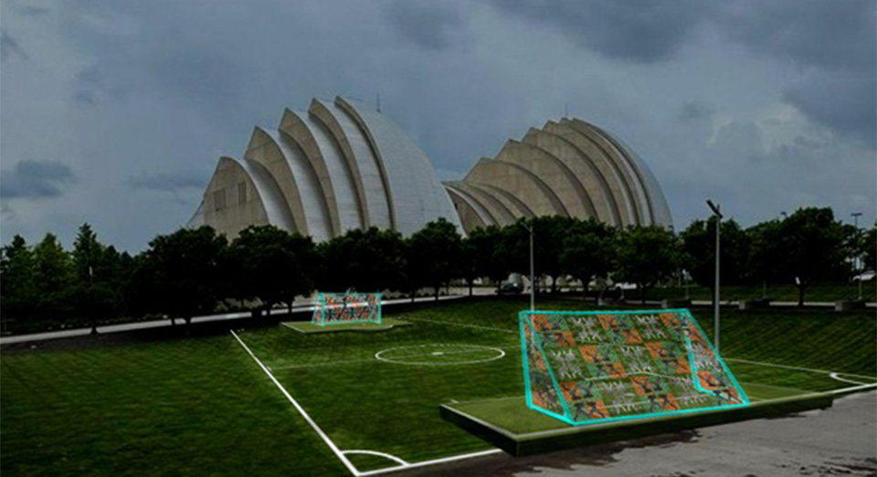A soccer field with a drawing of a soccer goal net with multicolored designs.